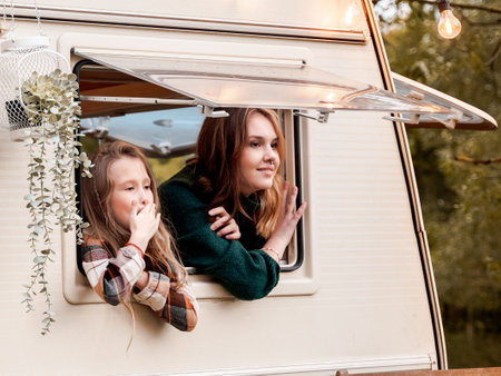 Children,family,brother sister traveling in camper,house on wheels. Trailer motor home.Looking in...