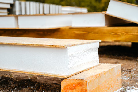 Building construction of wooden frame house made of SIP structural insulated panels. OSB oriented strand board, EPS expanded polystyrene. Energy-efficient eco-friendly green Canadian technology.の写真素材