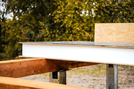Building construction of wooden frame house made of SIP structural insulated panels. OSB oriented...