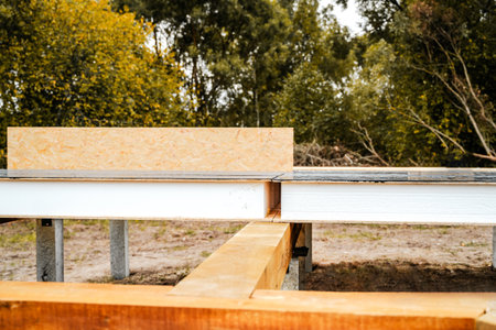 Building construction of wooden frame house made of SIP structural insulated panels. OSB oriented...