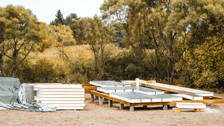 Building construction of wooden frame house made of SIP structural insulated panels. OSB oriented strand board, EPS expanded polystyrene. Energy-efficient eco-friendly green Canadian technology.の写真素材