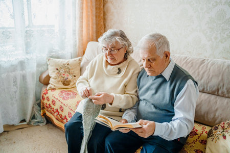 Elderly senior romantic love couple. Old retired man woman together. Aged husband wife in cozy home sweater.Elder hugging kissing people pensioner.Happy family longevity.Tender feelings relationships.の写真素材