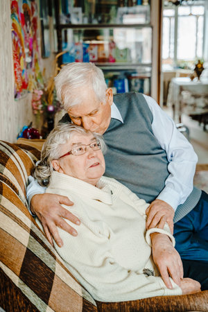 Elderly senior romantic love couple. Old retired man woman together. Aged husband wife in cozy home...