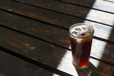 Cup of coffee on the wooden backgroundの写真素材
