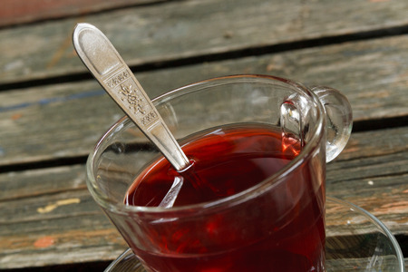 Tea cup on wooden backgroundの写真素材