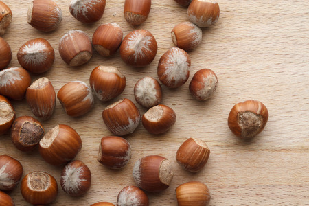 Hazelnut on wooden background