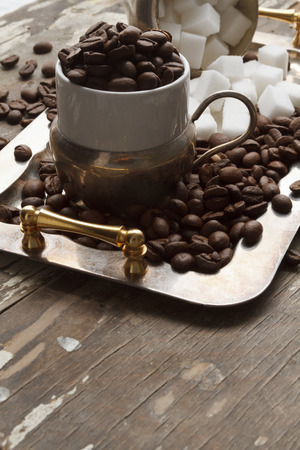 Coffee cup, beans and sugar cubesの写真素材