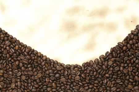 Coffee beans on old paperの写真素材