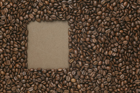 Caffe edition, coffee beans on old brown paperの写真素材