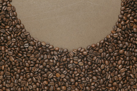 Caffe edition, coffee beans on old brown paper