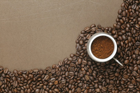 Caffe edition, coffee beans on old brown paperの写真素材