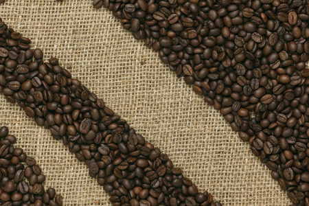 Caffe edition, coffee beans on Jute background