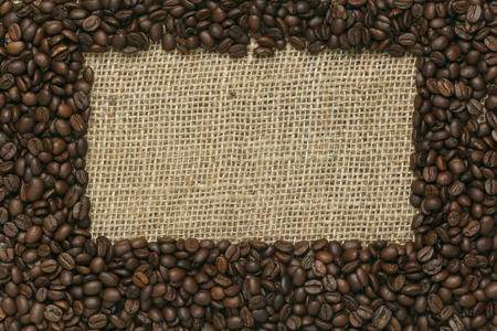 Caffe edition, coffee beans on Jute backgroundの写真素材
