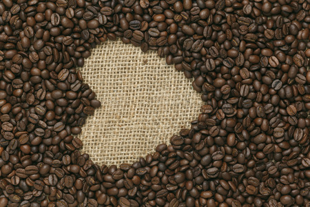 Caffe edition, coffee beans on Jute backgroundの写真素材