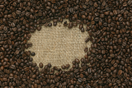 Caffe edition, coffee beans on Jute backgroundの写真素材