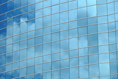 Reflection in windows of modern office building