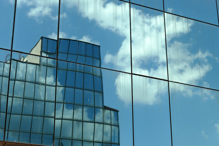 Reflection in windows of modern office building