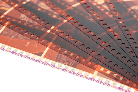 Old negative 35 mm film strip on white background, strip of tangled camera film - place for copy and space textの写真素材