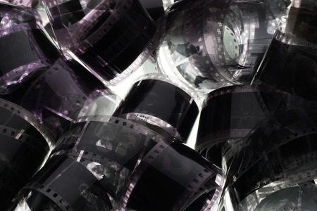 Old negative 35 mm film strip on white background, strip of tangled movie film - place for copy and space textの写真素材