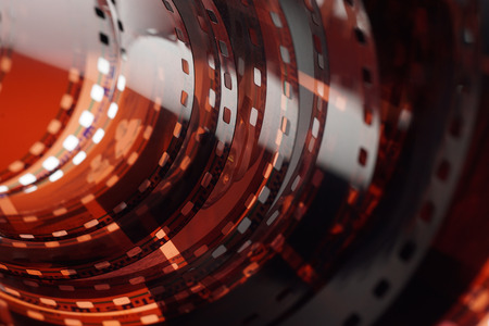 Old negative 35 mm film strip on white background, strip of tangled camera film - place for copy and space textの写真素材