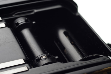 Part of the old dirty abandoned and forgotten  photographic camera on white background - place for copy and space textの写真素材