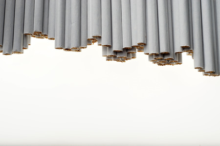 Heap of Tobacco Cigarettes, stack as a background texture, close up from the frontの写真素材