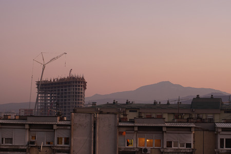Unfinished building. Scaffolding at construction siteの写真素材