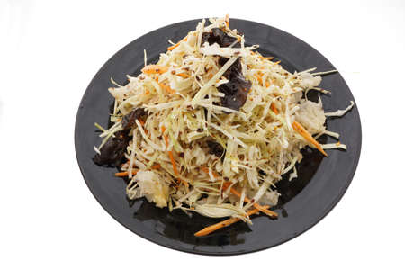 Chinese food. Hot salad with cabbage and vegetables in black plate isolated on white. Closeup.の写真素材