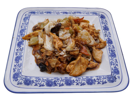 Chinese food. Fried chicken with vegetables in white plate isolated on white. Closeup.の写真素材