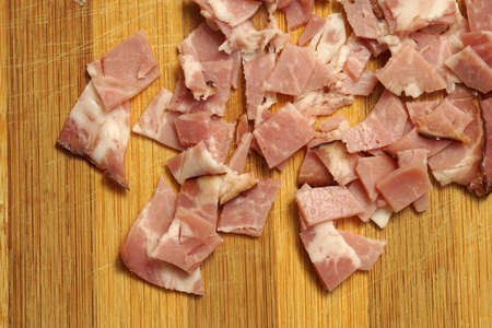 Sliced pork ham on wooden background. close-upの写真素材