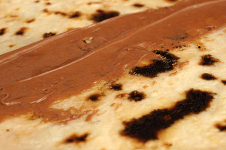 Fresh hot blinis or crepes spread on wooden boardの写真素材