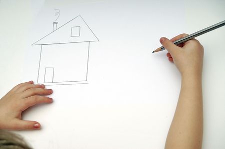 CHILD IS DRAWNING HOUSE ON  PAPERの写真素材