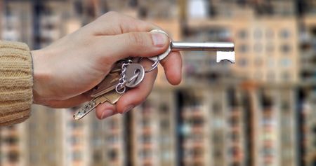 Real Estate agent hands over the keys.