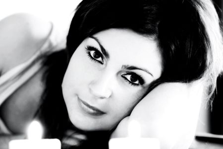 An image of a woman with two candlesの写真素材