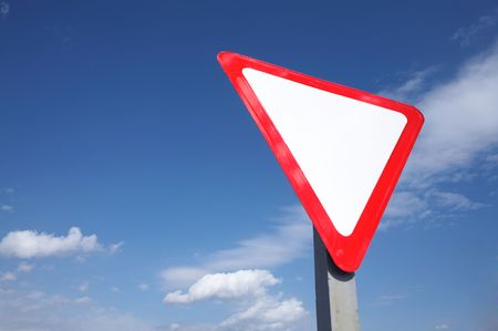 A white triangle with red stripe on a background of blue skyの写真素材