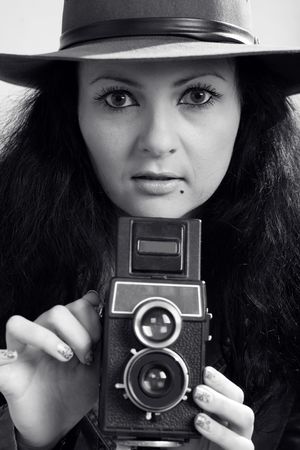 An image of photographer-girl with retro cameraの写真素材