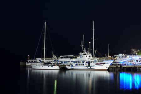 Yachts near the pier. Shot at night on long speedの写真素材