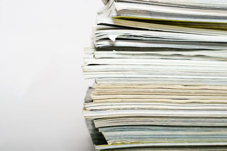 Stack of magazines on neutral background closeupの写真素材