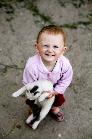 The happy -girl with a cat in her armsの写真素材