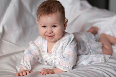 An image of bay-girl on the bed