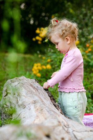 An image of little girl playing outdoorの写真素材