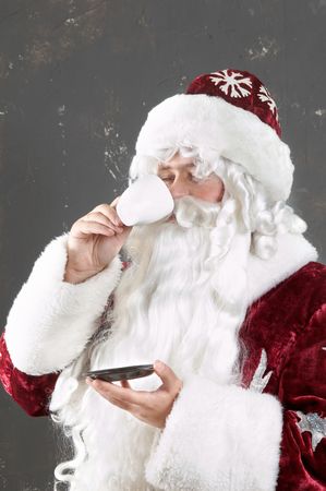 An image of Santa Claus drinking teaの写真素材