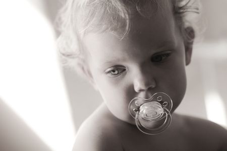 An image of cute baby in a studio