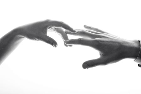 A black and white image of hands. Man and woman.の写真素材