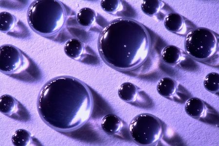 An image of water drops on neutral background