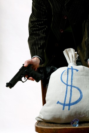 An image of a sack on a chair and man behind itの写真素材