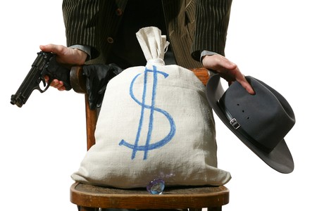 An image of a sack on a chair and man behind itの写真素材