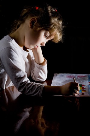 An image of a little girl with notebook and a pencilの写真素材
