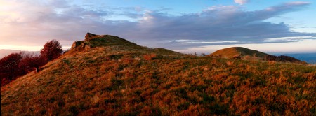 An image of autumn mountains covered with red grassの写真素材