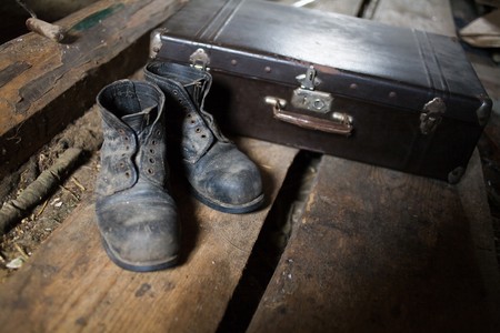 Stock photo: an image of old black boots an a black valiseの写真素材